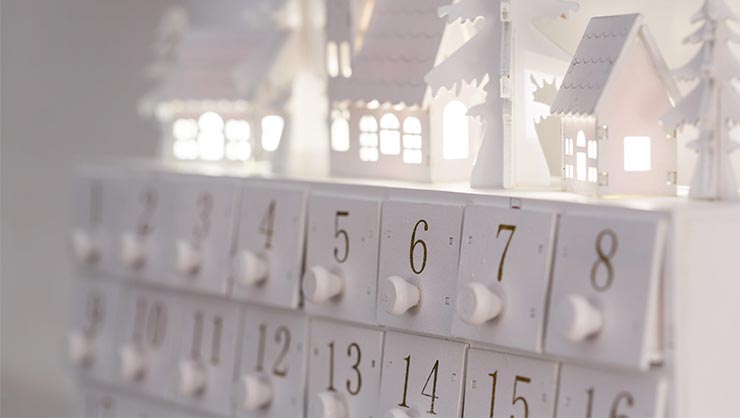 A white wooden advent calendar. 