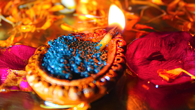 Candles and material associated with the holiday traditions of Diwali.