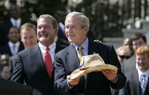 U.S. President George W. Bush holds a cowboy hat in Texas.