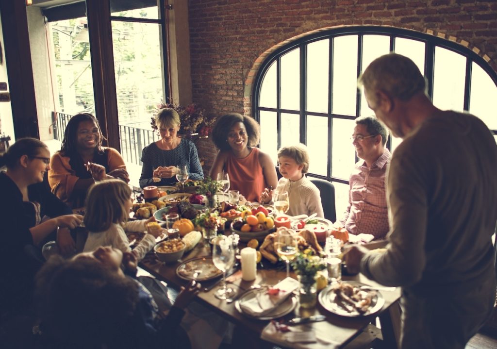 A group of people around a Thanksgiving table.