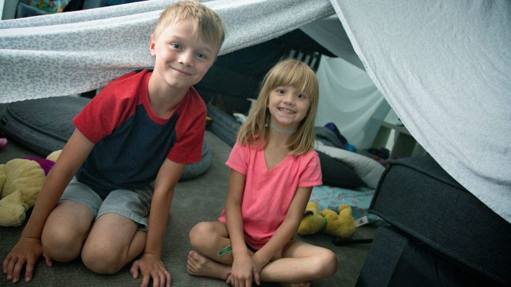 Building an indoor fort with their au pair