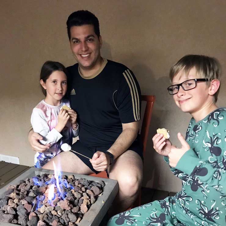 Danillo and his host kids enjoy classic S’mores.