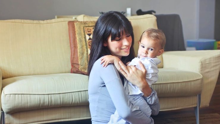 au pair holding baby