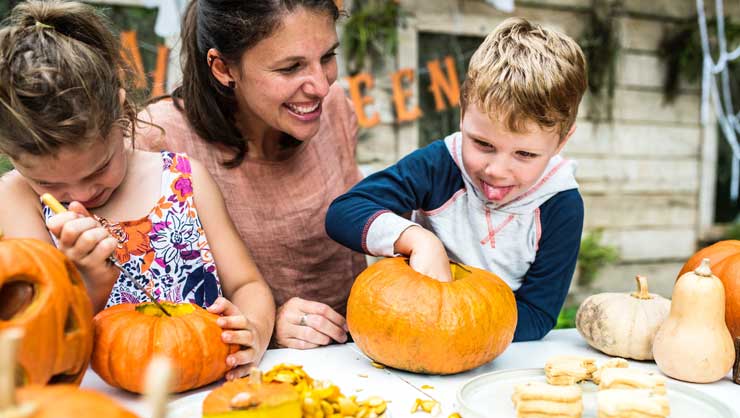 Your au pair will love carving pumpkins with your kids.