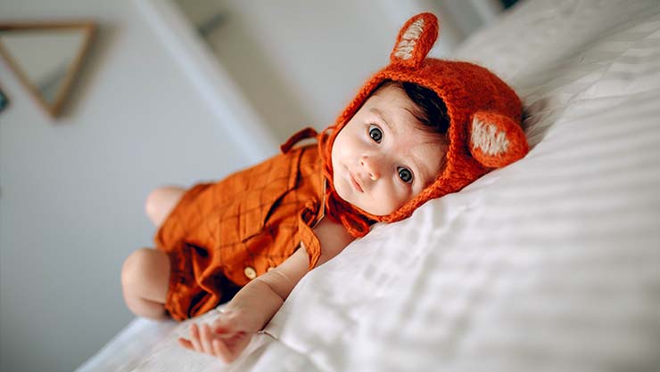 A baby with a fox hood.
